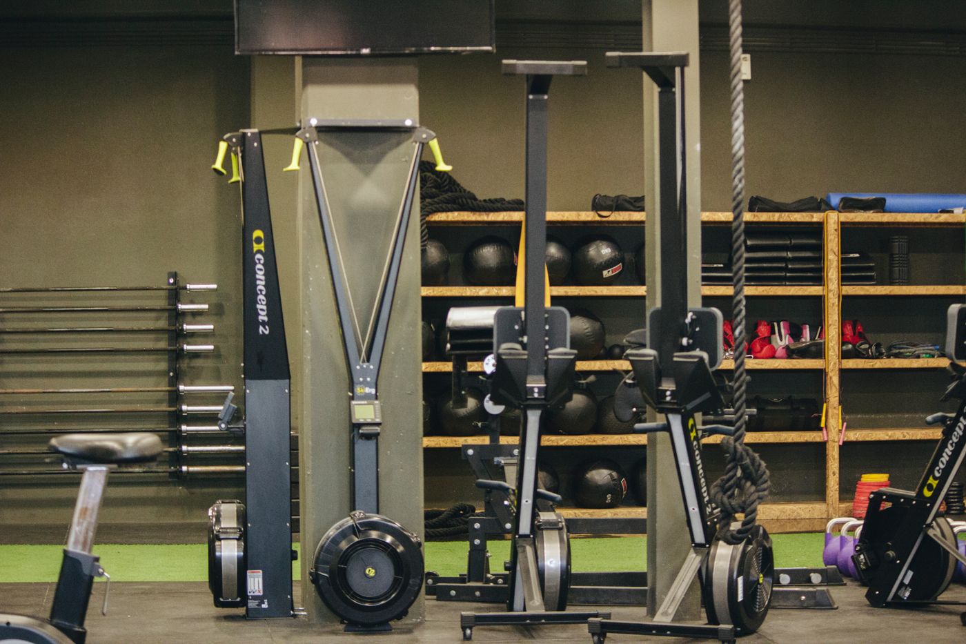 Functional training area with rowing machines, medicine balls and racks